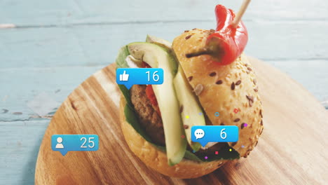 social media notifications overlay on burger placed on wooden board