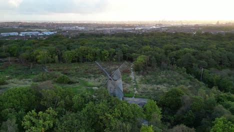 bidston windmill at dawn, aerial drone clockwise inwards pan and liverpool sunrise reveal