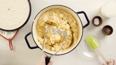 preparing classic mashed potatoes for thanksgiving dinner.