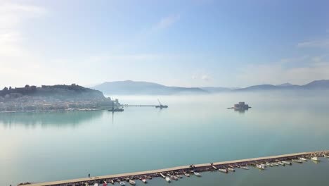 Pedestal-reveal-shot-of-Boutzi-Castle-Nafplion-town,-Greece