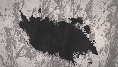 digital animation of black paint splatter with copy space against grunge texture on grey background