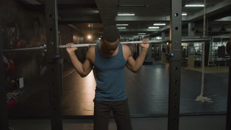 Front-view-of-an-athletic-african-american-man-in-the-gym.