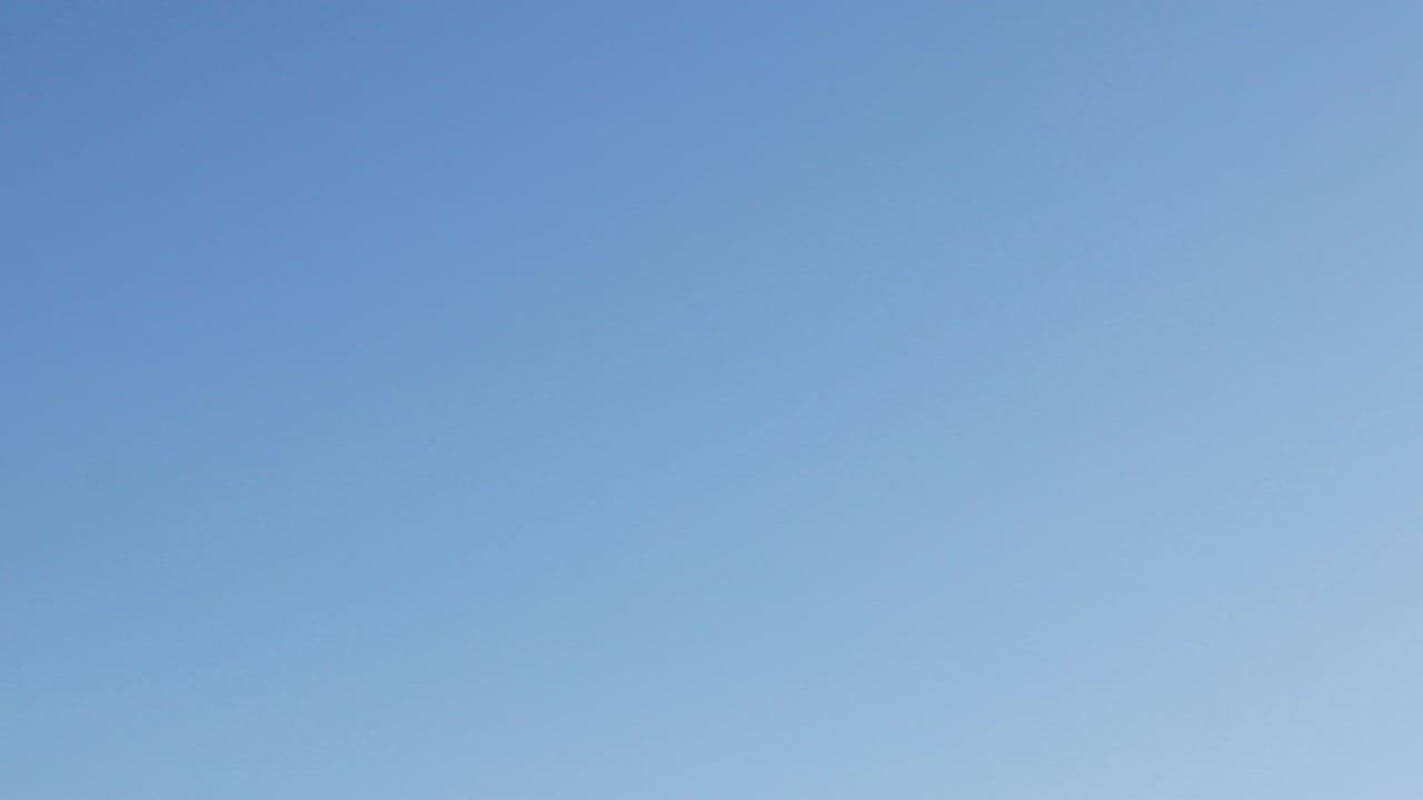 A plane flying across the screen