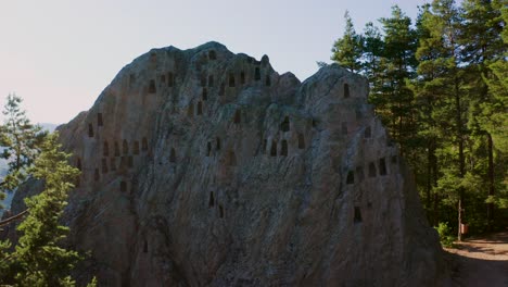 Approaching-drone-shot-of-a-historical-site-of-the-Eagles-Rock-also-called-Orlovi-Skali,-a-sacred-site-on-Rhodope-Mountains-in-Bulgaria