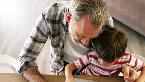 Father-and-son-using-laptop