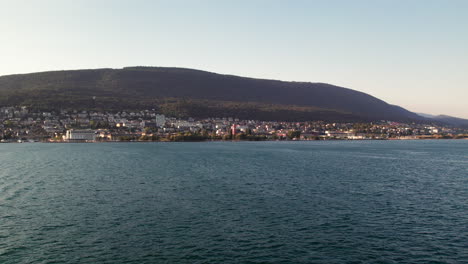 Beautiful-RomantiC-City-of-Neuchâtel-in-Switzerland-seen-from-the-lake-in-a-Gorgeous-Evening-Sunset-Atmosphere