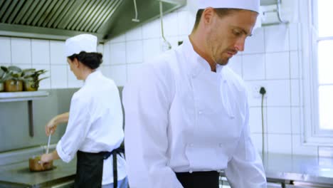 chef chopping vegetables on chopping board 4k