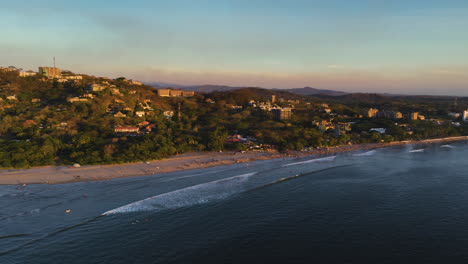 aerial view approaching the coastline of guanacaste, sunny evening in costa rica