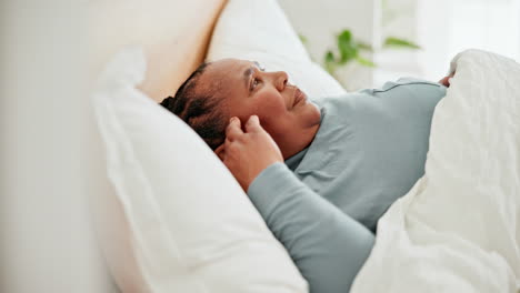 senior woman, sad and wakeup in bed with grief