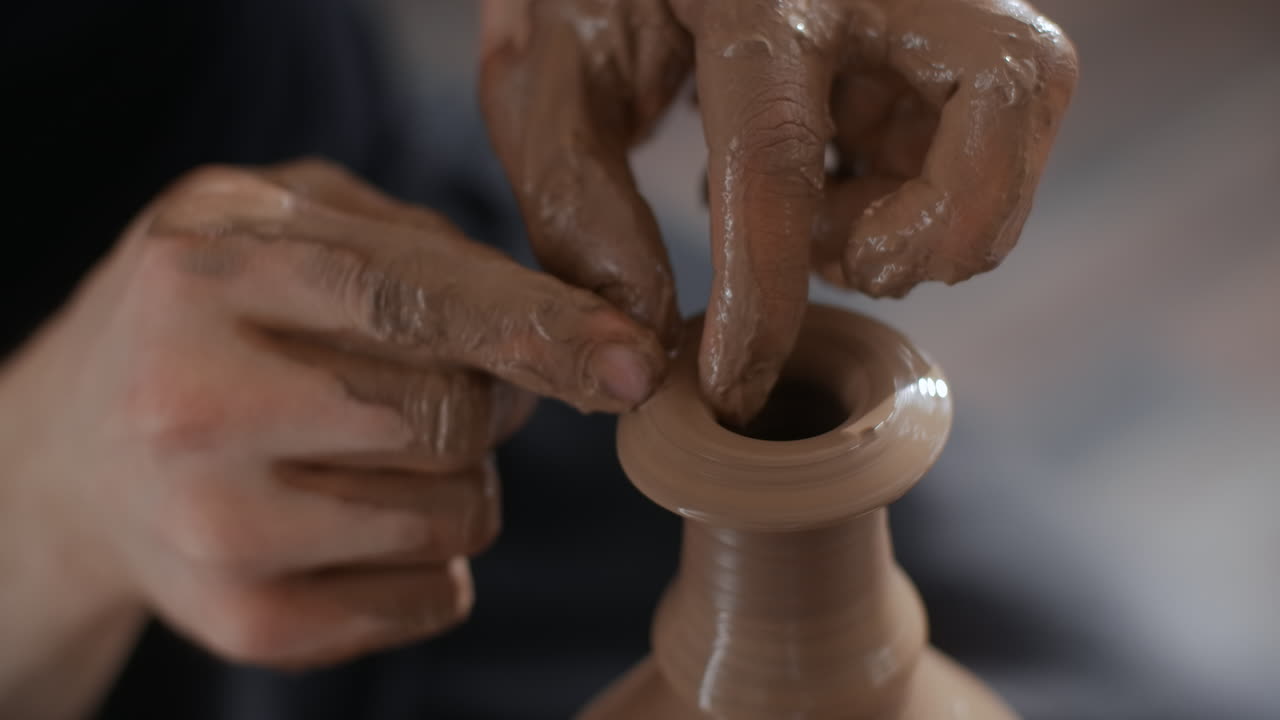 Hands Shaping a Clay Vase