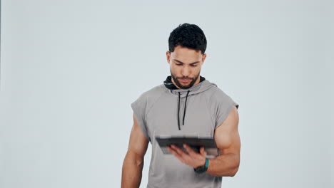 Fitness,-tablet-and-man-flex-in-studio