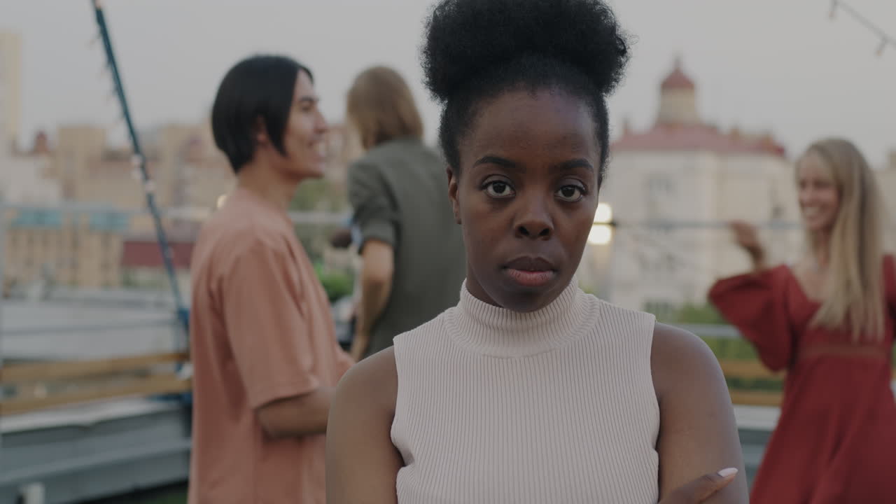 Diverse group of friends enjoying a rooftop party