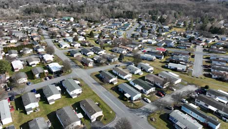 drone rising shot of american neighborhood with home and similar buildings