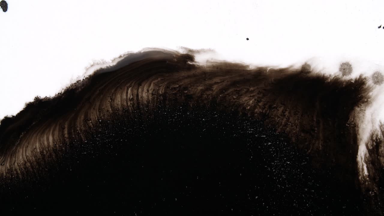 Black Ink Drops On White Background