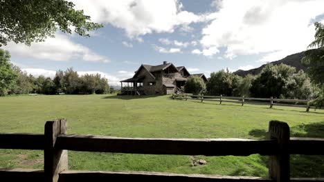 beautiful ancient stone house with luxury garden and fence in patagonia, argentina
