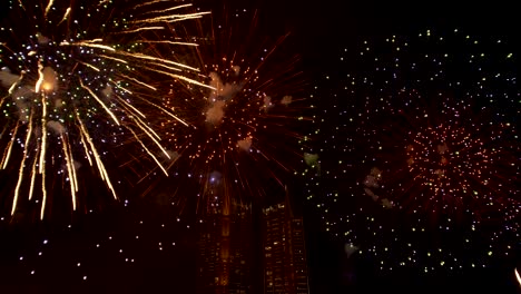 the real fireworks celebration colorful sky in the background black and the text happy new year 2020.