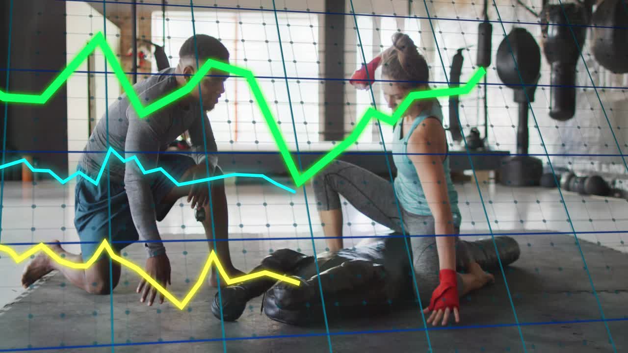 Coach leaning, urging trainee adjusting red wraps, striking grappling dummy as grid tracking boxing