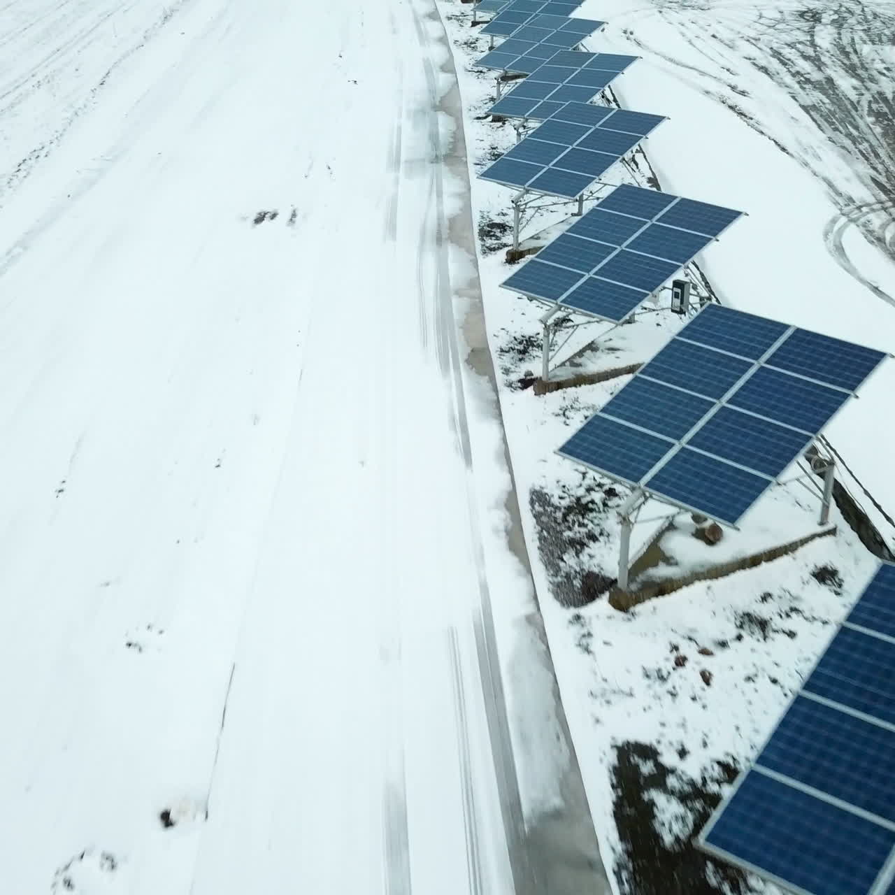 Alternative energy solar power plant in the winter. Solar power plant on the outskirts of the city.