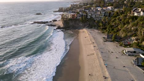 Aerial-view-of-Thousand-Steps-Beach,-Laguna-Beach,-California,-wide-shot-forward-tilt-up-reveal