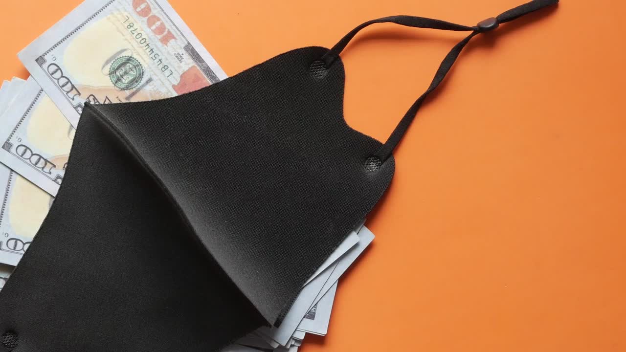 Money hidden under a face mask