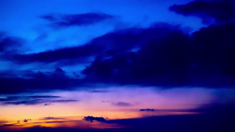 4k-sunset-clouds-hyperlapse-froming-from-dark-clear-blue-sky-to-puffy-morphing-cloudy-orange-golden-burgundy-purple-pink-violet-glowing-colors-of-awesome-visual-stunning-movements-of-heavenly-sight3-3