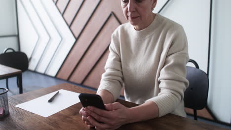 adult student using tablet in classroom