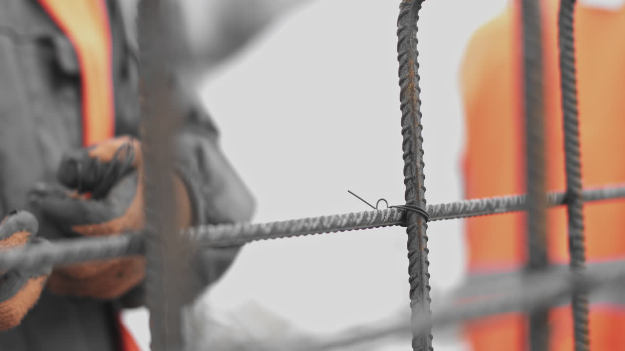 Construction worker reinforcing rebar