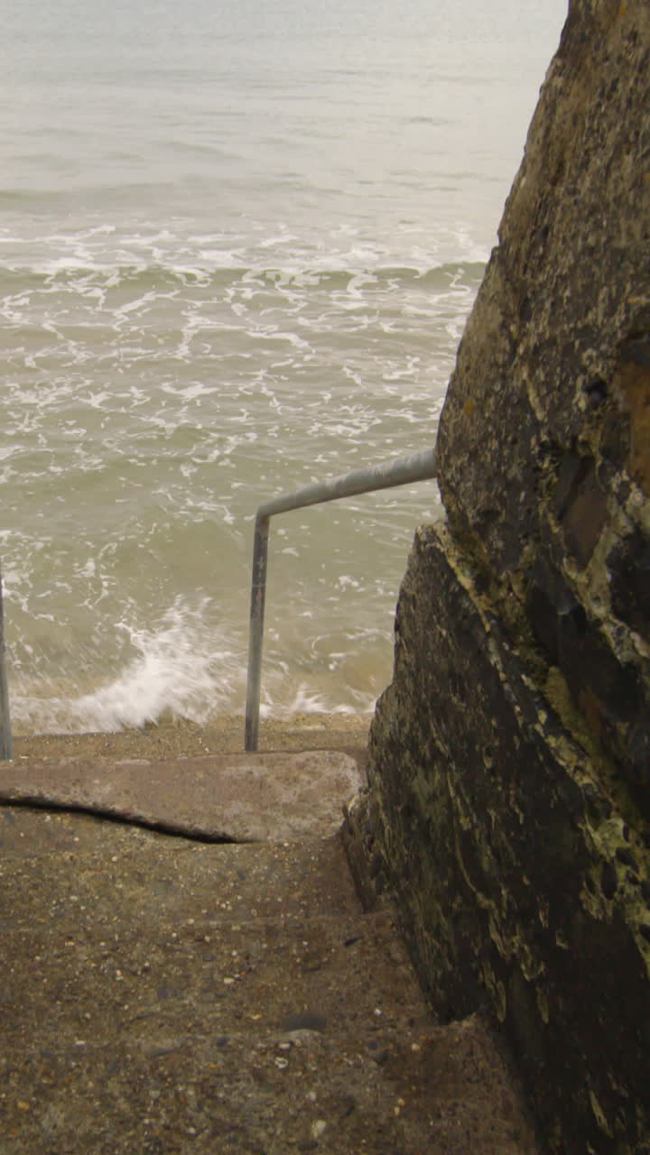 Concrete stairs leading into the ocean