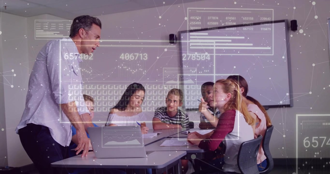 Instructor opening laptop in classroom and presenting animated data overlays for engaging students