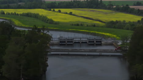 Reelfoot-lake-state-park,-tennessee,-with-a-dam-and-blooming-yellow-fields-in-the-background,-aerial-view