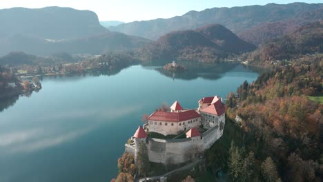 beautiful aerial dolly overlooking clifftop castle lake bled slovenia sunny day