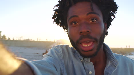 black man waving during a video call