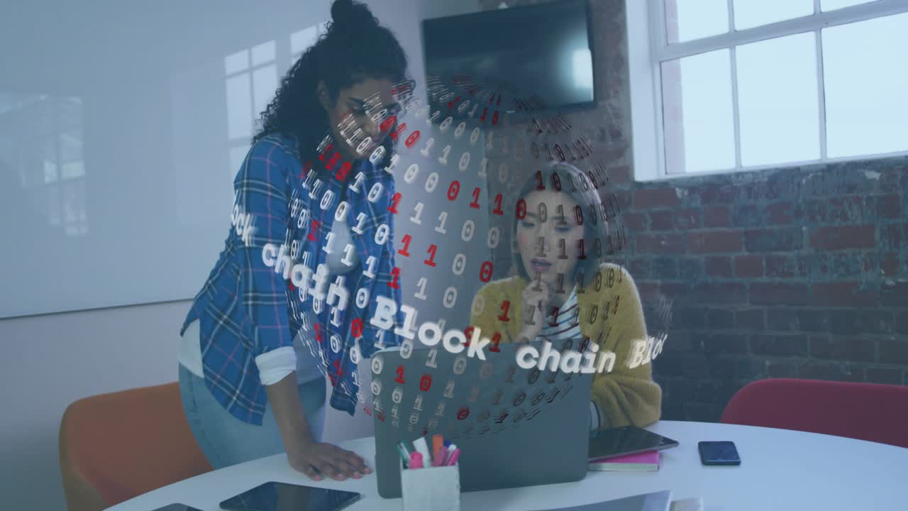 Two colleagues typing and noting during blockchain sphere appearing on laptop for analysis