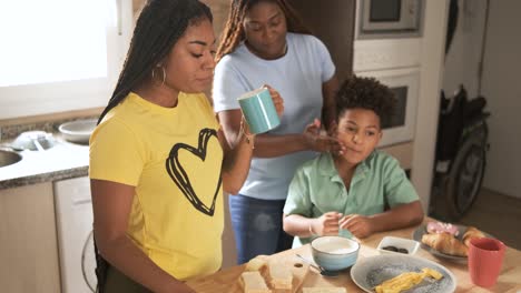 family having breakfast together in the kitchen