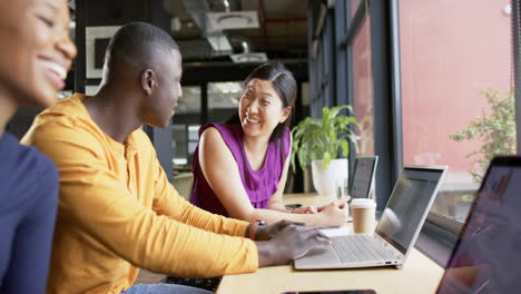 Casual diverse business people talking working together in office, slow motion, copy space