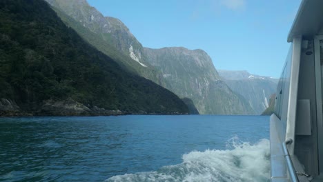 maritime marvel: boat gracefully enters milford sound in captivating stock footage