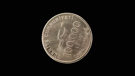 turkey 2000 commemorative 100 000 lira coin obverse with crescent star and value rotating on black background
