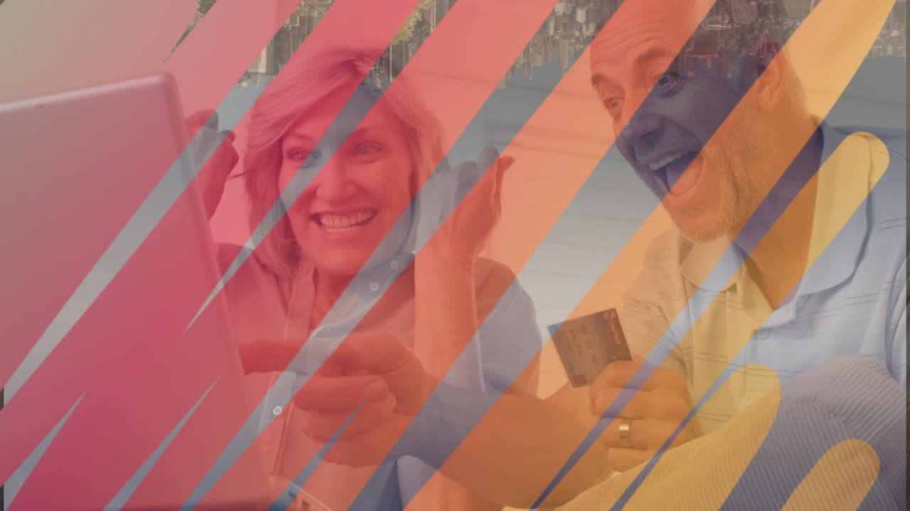 animación de formas sobre una pareja caucásica usando una computadora portátil