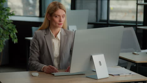 businesswoman working and offering handshake in office