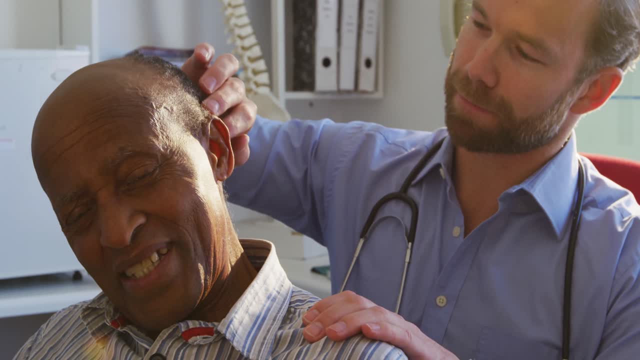 Doctor examining a senior man in a retirement home