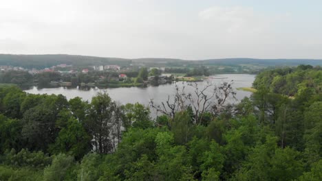 Truck-shot-of-a-lake-and-trees-in-Kolbudy-