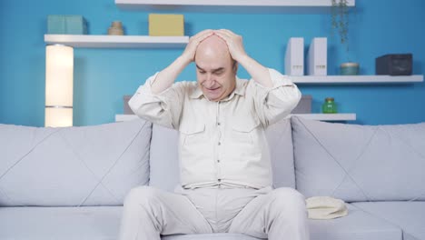 Depressed-and-sad-old-man-talking-to-himself-at-home-alone.