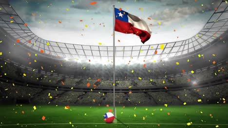 confeti cayendo sobre la bandera de chile contra el estadio deportivo en el fondo
