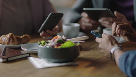 business people hands using smartphone browsing working online collaborating on mobile phone networking together friends relaxing in cafe drinking coffee enjoying leisure lifestyle close up