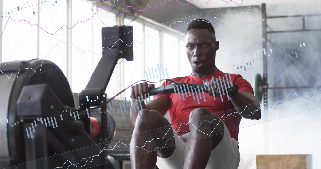 Man gripping handle and starting pull driving rowing in gym with data overlays tracking fitness