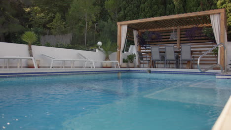 luxury poolside patio with pergola