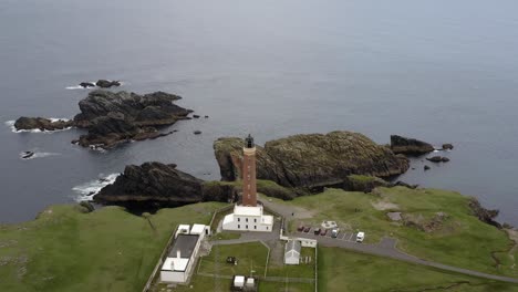 drone shot of the tarbat ness lighthouse in ness on a sunny, summer's day