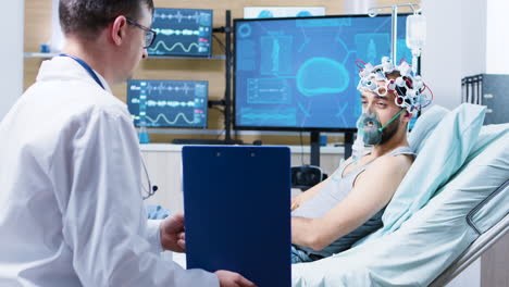 patient in a neuroscience centre wearing brainwaves scanning headset and air mask