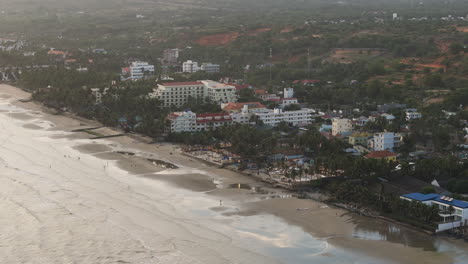 Aerial-view-Mui-Ne-Vietnam-asia-fisherman-coastline-bay-village-south-central-Bình-Thuan-Province-drone-footage-at-sunset-party-touristic-south-east-Asia-travel-destination