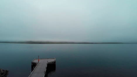 foggy morning in faskrudsfjordur fiord in east iceland